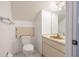 Cozy half bathroom with a toilet and small vanity with storage at 498 Lakeview Dr # 45, Palm Harbor, FL 34683