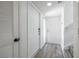 Bright foyer with hardwood floors, white doors, and staircase leading to the upper level at 498 Lakeview Dr # 45, Palm Harbor, FL 34683