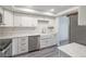 Modern kitchen featuring white cabinets, quartz countertops, stainless steel appliances, and a farmhouse sink at 498 Lakeview Dr # 45, Palm Harbor, FL 34683