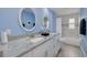 Bathroom with double vanity, granite countertop, and tiled shower at 505 Broxburn Ave, Temple Terrace, FL 33617
