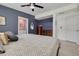 Stylish main bedroom with a ceiling fan, ensuite bath access, and plenty of natural light at 505 Broxburn Ave, Temple Terrace, FL 33617