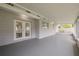 Covered outdoor patio with plenty of space for entertaining at 505 Broxburn Ave, Temple Terrace, FL 33617