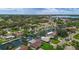 Overhead shot showing a waterfront neighborhood with canals, mature trees, and a home's proximity to the ocean at 5285 Dover Ne St, St Petersburg, FL 33703