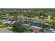 Scenic aerial view of a waterfront home with canal access, lush greenery, and neighborhood charm at 5285 Dover Ne St, St Petersburg, FL 33703