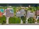 Waterfront property featuring a private boat dock, a refreshing pool, and well-maintained backyard at 5285 Dover Ne St, St Petersburg, FL 33703