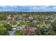 Aerial view of the home's location in a coastal neighborhood with mature trees and canals leading to the ocean at 5285 Dover Ne St, St Petersburg, FL 33703