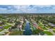 Expansive aerial shot of a waterfront community with picturesque canals and stunning city skyline view at 5285 Dover Ne St, St Petersburg, FL 33703