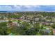 Aerial view showcasing a waterfront community with mature trees, canals, and access to open waters for boating and recreation at 5285 Dover Ne St, St Petersburg, FL 33703
