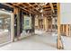 Renovated living room featuring exposed studs, tile flooring and bright and airy space with the view to the patio at 5285 Dover Ne St, St Petersburg, FL 33703
