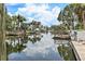 Picturesque waterfront view showcasing private docks and lush tropical landscaping at 5285 Dover Ne St, St Petersburg, FL 33703