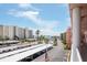 Scenic balcony view of buildings and the sea on a sunny day at 6025 Shore S Blvd # 408, Gulfport, FL 33707