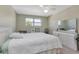 Light-filled bedroom with light gray floors, large windows, and a view of the cityscape at 6025 Shore S Blvd # 408, Gulfport, FL 33707