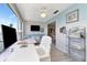 Bedroom with waterfront views and seating area at 6025 Shore S Blvd # 408, Gulfport, FL 33707