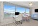Bedroom with views of the water and seating area at 6025 Shore S Blvd # 408, Gulfport, FL 33707