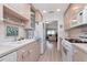Charming kitchen with white appliances and wood flooring at 6025 Shore S Blvd # 408, Gulfport, FL 33707