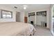 Main bedroom featuring spacious closet, dresser and exterior access at 6025 Shore S Blvd # 408, Gulfport, FL 33707