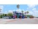 Vibrant restaurant building with colorful murals, outdoor seating, and convenient parking spots at 6025 Shore S Blvd # 408, Gulfport, FL 33707
