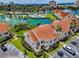 Gorgeous aerial view of villas surrounding lakes, palm trees and community pool at 6080 Bahia Del Mar Cir # 109, St Petersburg, FL 33715