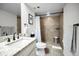 Bathroom with modern granite sink, walk-in shower, and upgraded fixtures at 6080 Bahia Del Mar Cir # 109, St Petersburg, FL 33715