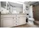 Updated bathroom with a dual sink vanity with granite countertops and walk-in shower at 6080 Bahia Del Mar Cir # 109, St Petersburg, FL 33715