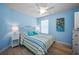 Cozy bedroom with a ceiling fan, wood-look floors, and a calming, light-blue color scheme at 6080 Bahia Del Mar Cir # 109, St Petersburg, FL 33715