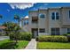 Inviting two-story condo featuring well-maintained landscaping and private entrance with stairs and neutral paint at 6080 Bahia Del Mar Cir # 109, St Petersburg, FL 33715