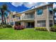Inviting condo featuring a private balcony with a manicured lawn and lush landscaping at 6080 Bahia Del Mar Cir # 109, St Petersburg, FL 33715