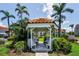 Charming gazebo surrounded by lush greenery and palm trees offers a peaceful retreat at 6080 Bahia Del Mar Cir # 109, St Petersburg, FL 33715