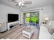 Inviting living room with sliding glass doors opening to a picturesque outdoor view and patio at 6080 Bahia Del Mar Cir # 109, St Petersburg, FL 33715