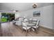 Bright and inviting living area with wood floors, lake views, sliding glass door, ceiling fan and comfortable seating at 6080 Bahia Del Mar Cir # 109, St Petersburg, FL 33715