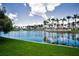 Scenic water view with lush greenery and palm trees lining the banks under a bright blue sky at 6080 Bahia Del Mar Cir # 109, St Petersburg, FL 33715