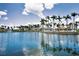 Expansive water view framed by swaying palm trees and well-manicured landscaping under sunny skies at 6080 Bahia Del Mar Cir # 109, St Petersburg, FL 33715
