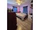 Bedroom with wood floor, large dresser, and large window at 6326 38Th N Ave, St Petersburg, FL 33710