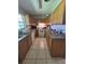 Functional kitchen with tile floor, white appliances, and ample cabinet space, ready for updates at 6326 38Th N Ave, St Petersburg, FL 33710