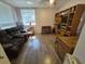 Spacious living room with laminate floors, large window, and custom built-in shelving, offering ample storage at 6326 38Th N Ave, St Petersburg, FL 33710