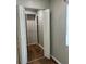 A closet with louvered doors and built-in shelving, adding functionality to the room at 6383 Biscayne, North Port, FL 34287