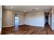 Spacious living room with wood-look tile, sliding doors to screened in porch at 6383 Biscayne, North Port, FL 34287
