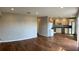 Open-concept living space featuring wood floors, a kitchen with modern appliances, and ample natural light at 6383 Biscayne, North Port, FL 34287