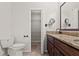 Charming bathroom featuring a vanity with granite countertops, and ample storage space at 7021 Blossom Ave, Tampa, FL 33614