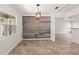 Dining area with a decorative wall, large window, and tile flooring throughout at 7021 Blossom Ave, Tampa, FL 33614