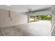 Spacious garage with an automatic door opener and view of the driveway and street at 7021 Blossom Ave, Tampa, FL 33614