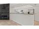 Open kitchen featuring stainless steel appliances, granite countertops, and breakfast bar at 7021 Blossom Ave, Tampa, FL 33614