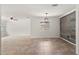 Open living space with tile floors, decorative wall, and views into other living areas at 7021 Blossom Ave, Tampa, FL 33614
