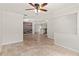 Spacious living room with tile flooring, decorative wall, and open layout to the kitchen at 7021 Blossom Ave, Tampa, FL 33614