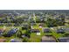 Aerial view of a quiet neighborhood with well-maintained homes and tree-lined streets at 7061 Denmark St, Englewood, FL 34224