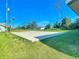 Expansive backyard with a large concrete pad, perfect for outdoor activities at 7061 Denmark St, Englewood, FL 34224