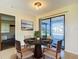 Cozy dining area with a round table and sliding door to the lanai at 7061 Denmark St, Englewood, FL 34224