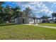 Beautiful home with a well-maintained lawn and attached carport at 8017 Tudor Pl, Tampa, FL 33610