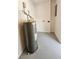 Interior shot of the utility room featuring a gray hot water heater at 8017 Tudor Pl, Tampa, FL 33610