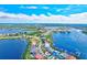 Aerial view showcasing the neighborhood's desirable waterfront location, beautiful homes, and boating access at 8211 Brent St # 815, Port Richey, FL 34668